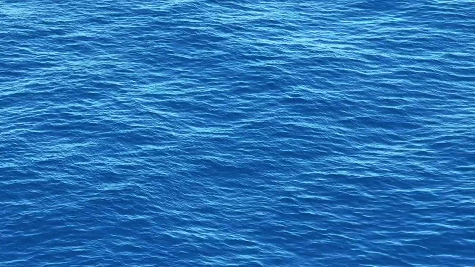 The open sea seen from the deck of a boat