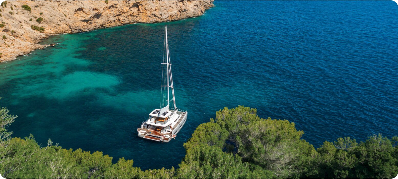 Catamaran anchored in a cove