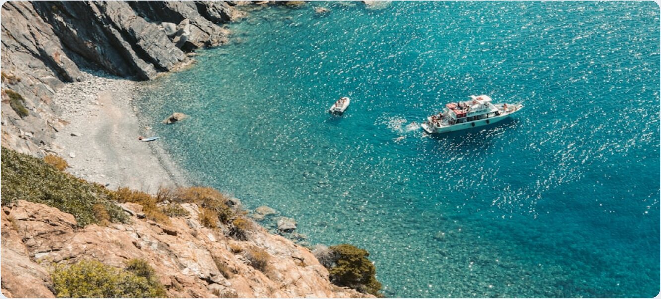 Boats anchored in a cove of the Tuscan Archipelago